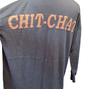 Light cardigan. Graffiti on the back